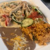 Pollo Con Crema · Tender chicken strips cooked in authentic  Mexican cream with green peppers, onions, and mus...