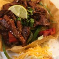 Fajitas Salad · Choice of chicken, steak, or shrimp with shredded lettuce and grilled onions and peppers in ...