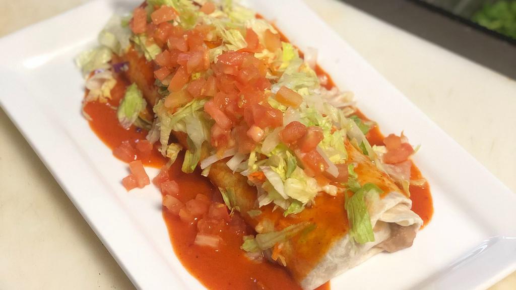 Garden Fresh Burrito · Lightly sautéed fresh seasonal vegetables, rice and whole black bean wrapped in a flour served with with red sauce, lettuce and tomatoes.