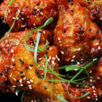 Korean Chicken Wings · Gochujang glaze, sesame seeds, scallions. For 6.