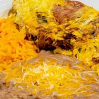Shredded Beef & Eggs Breakfast Plate · Shredded Beef & Scrambled Eggs served on a plate with Mexican Rice and Refried Beans. With y...