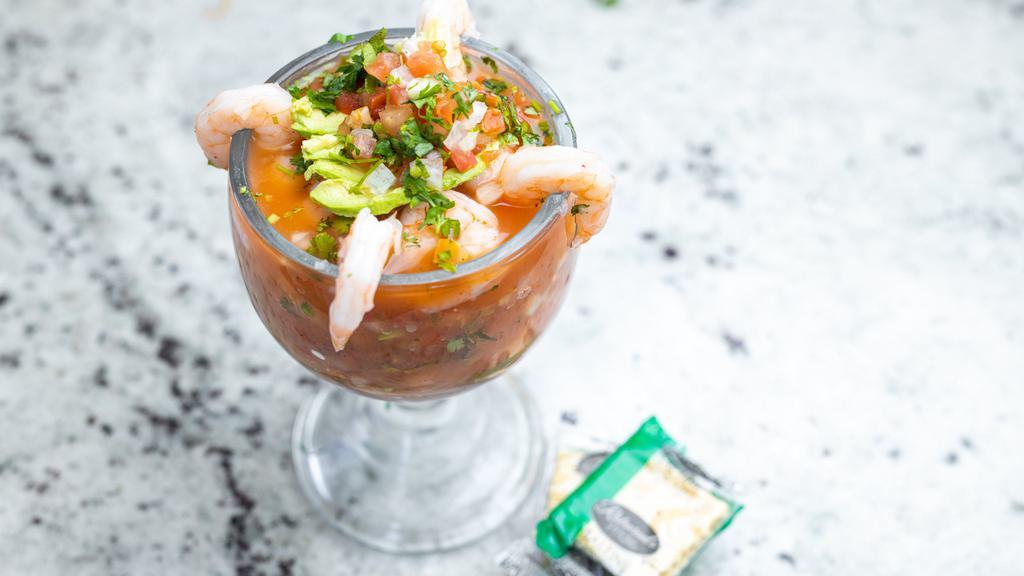 Shrimp Coctel · Whole Shrimp, diced Cucumbers, Tomatoes, Onions and Cilantro served in cup with our in-house blend of Clamato Cocktail Juice.