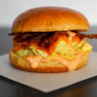 Bacon, Egg And Cheddar Brioche Sandwich · 2 fresh cracked cage-free scrambled eggs, melted Cheddar cheese, smokey bacon, and Sriracha ...