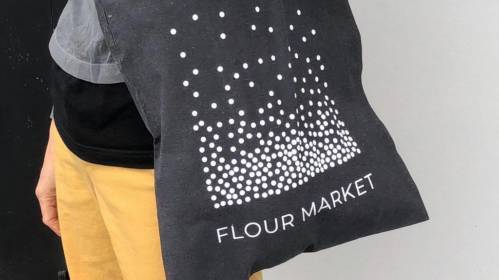 Cotton Tote - Steel Grey · The world's coolest logo on the world's greatest recycled cotton tote bag. Perfect for hauling home your Flour Market treats, or for pulling out at the grocery store to the envy of all.