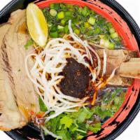 Spicy Beef Ramen · A hearty beef broth with shoyu base. Topping comes with a tender beef back rib, beef brisket...