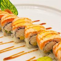 Melting Orange · Avocado, cucumber, crab salad, topped with seared salmon, and sweet sushi sauce.