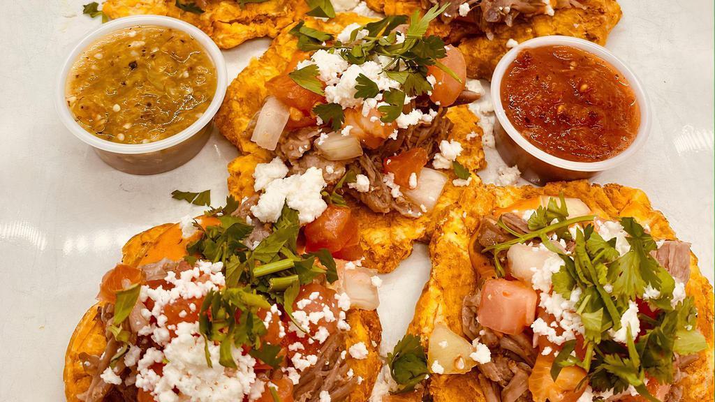 Pork Tostones · Green fried plantains lightly salted, cuban roast pork, pico de gallo, cheese, cilantro and chipotle mayo.