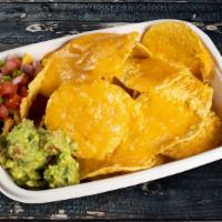 Free The Nachos · Corn chips covered with beans, black olives, jalapeños and melted cheese, sour cream. Add ch...