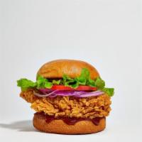 West Fried Story · Dish out on crispy fried chicken, crispy lettuce, and fresh tomato. Served on a griddled ses...