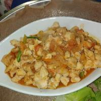 Doro Tibs · Chicken breast tibs with onions, garlic, jalapeño, tomato, and rosemary.