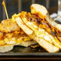 Breakfast Sandwich · Two eggs, choice of meat, onions, bell peppers, mushrooms, hash-browns all piled high topped...