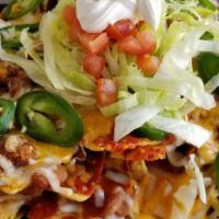 Red Chile Carne Nachos · Three fully loaded pounds of nachos, local beans, red Chile, carne adovada, jalapenos, lettu...