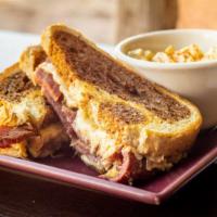 Reuben · Slow roasted corned beef topped sauerkraut, swiss cheese, and a housemade remoulade on marbl...