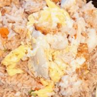 Crab Fried Rice · Stir fried jasmine rice with crab meat, egg, onions, carrots and peas.