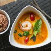 Pineapple Prawns Curry · Prawns, pineapple, broccoli, cherry tomatoes, Thai basil, and bell pepper in a light red cur...