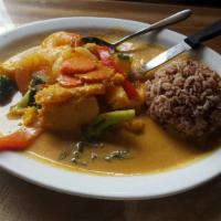 Squash Curry Prawns · Sweet kabocha squash, broccoli, Thai basil, and bell peppers in a red curry. Served with a s...