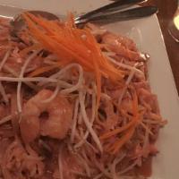 Mee Gra Tee · Sweet pink rices noodles with a combination of chicken, tofu, and prawns stir fried with egg...