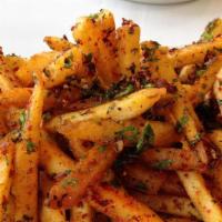 Masala Fries · A plate of seasoned fries served with ketchup or chutney.