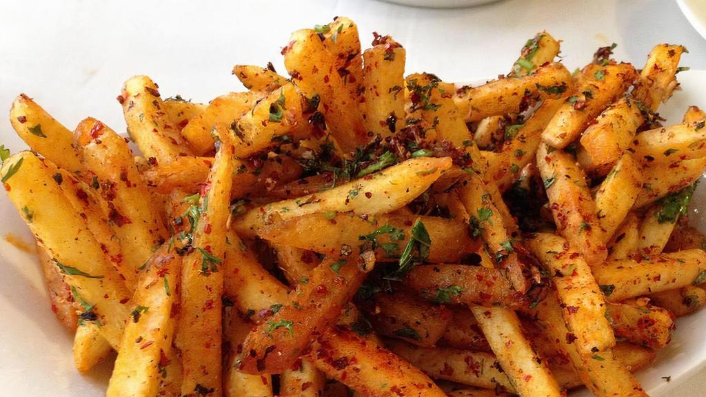 Masala Fries · A plate of seasoned fries served with ketchup or chutney.