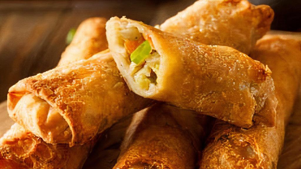 Vegetable Spring Rolls · 4 pieces. Mixed vegetables wrapped in rolls of rice paper and deep fried.