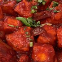 Paneer Chilli Gravy · Indian cheese stir-fried with green bell pepper and red onions in chili sauce