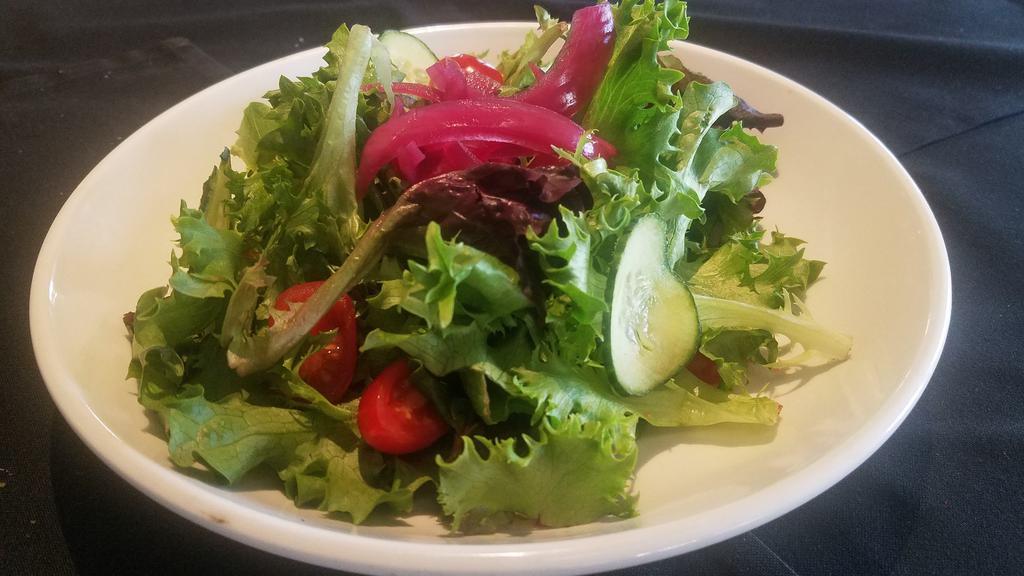 Simple Salad · Vegan, gluten  free. greens, tomato, cucumber.