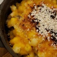 Baked Mac & Cheese · Three cheeses blended to perfection
