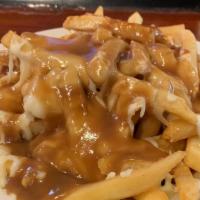 Poutine Fries · Crispy french fries smothered with mozzarella cheese & rich brown gravy.