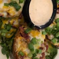 Reuben Potato Skins · Fried potato boats filled with corned beef, sauerkraut, cheddar and Swiss cheese & thousand ...
