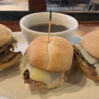 Oui Dips (Order Of 3) · Three sliders with roast beef, Swiss cheese, and au jus.