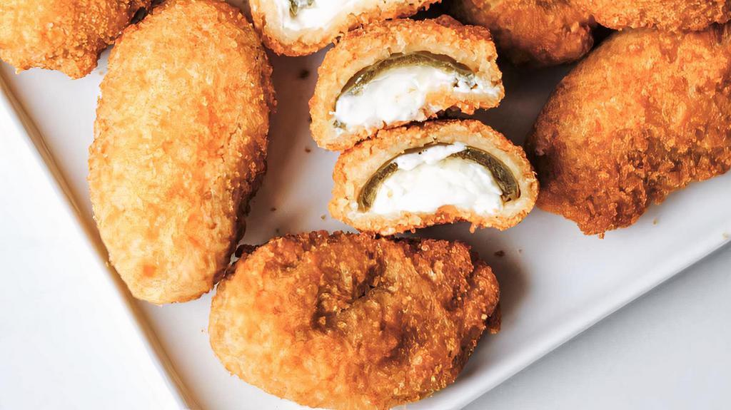 Jalapeno Poppers · 6 breaded Jalapeños filled with Cream Cheese.  Served with Ranch and Jam for dipping.  Double-dipping recommended.
