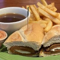 Vegan French Dip · Thinly sliced tofurky roast beef and Swiss cheese on a hoagie roll served with warm au jus.