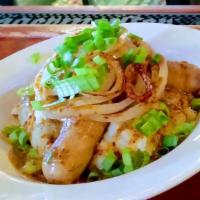 Bangers & Mash · Plump guinness pork brats, grilled and served on a pile of creamy mashed potatoes, covered w...