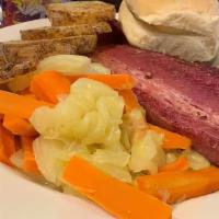 Corned Beef & Cabbage · Slow Smoked corned beef brisket, seared then served with stewed potatoes, carrots, and cabba...