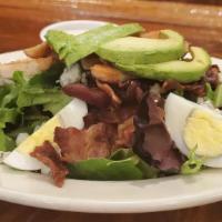 Cobb Salad · Mixed fresh field greens, crisp bacon, grilled and sliced chicken breast, sliced avocados, t...