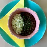 Rice & Beans · White Rice and our House seasoned slow-cooked Black Beans.