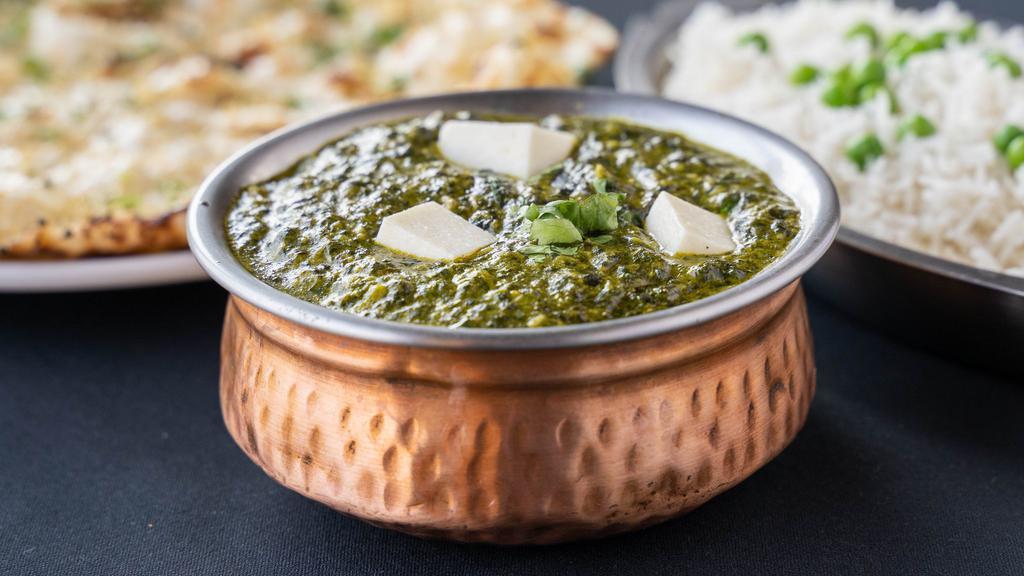 Saag Paneer · Spinach cooked with homemade cheese in cream and spices.
