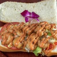 Shrimp Po Boy · Garlic marinated shrimp on a bed of shredded lettuce and tomato topped with our sweet and sp...