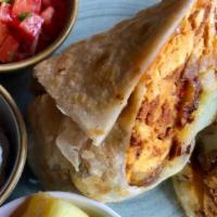 Sasquatch Breakfast Wrap · pork chorizo, scrambled eggs, 
three cheeses, potatoes, caramelized onion, flour tortilla, s...