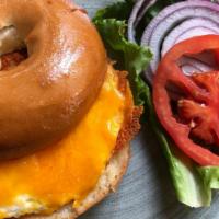 Bagel Egg & Cheese · Toasted New York bagel, fried egg, melted cheese, lettuce, tomato, onion, pesto mayo