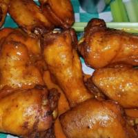 Wings · 10 Jumbo Bone-In Wings, tossed in your choice of wing sauce, served with your choice of Ranc...
