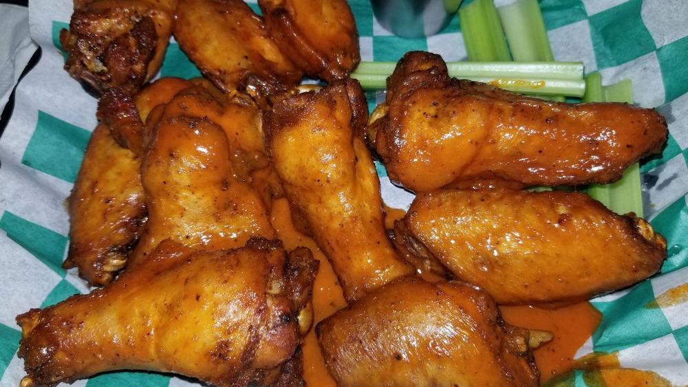 Wings · 10 Jumbo Bone-In Wings, tossed in your choice of wing sauce, served with your choice of Ranch or Blue Cheese.
One Wing Sauce Per Order.