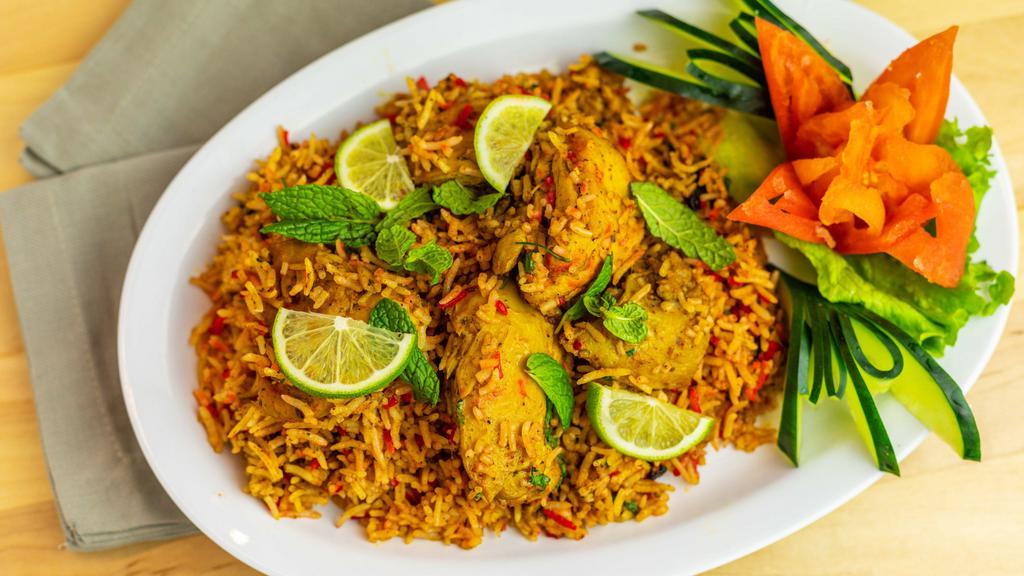 Biryani · Indian fried rice cooked with spices & herbs.