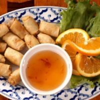 Thai Spring Rolls · Vegetables wrapped in rice paper, lightly fried and served with sweet and sour sauce.