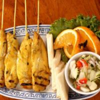 Chicken Satay · Four pieces. Chicken marinated in thai grilles sauce on skewers and served with peanut sauce...