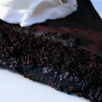 Warm Chocolate Cake · Vanilla bean ice cream, powdered sugar, fresh whipped cream