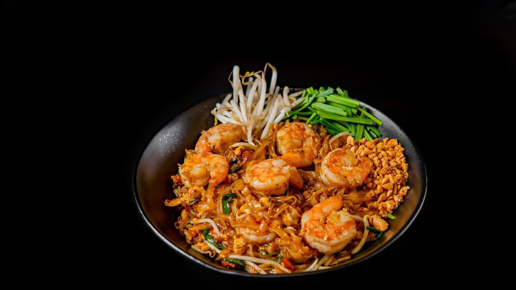 Pad Thai · Stir-fried noodle with egg, bean sprouts, chives and crushed peanuts on the side. Served with your choice of meat.