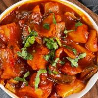 Fire Potatoes · Fried potatoes sauté in a tomato based spicy sauce with onions, bell peppers & garlic.