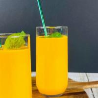 Mighty Mango Lassi · Delicious creamy drink with Mango, yogurt and milk (16 oz)
