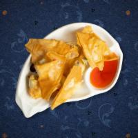 Crab Rangoon · (6 pieces) Golden fried wontons stuffed with cream cheese and crab meat Served with sweet an...